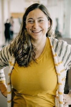 A smiling woman at a business networking event in Kansas City.